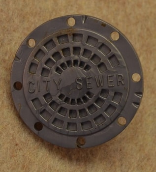 Silver Man Hole cover shield